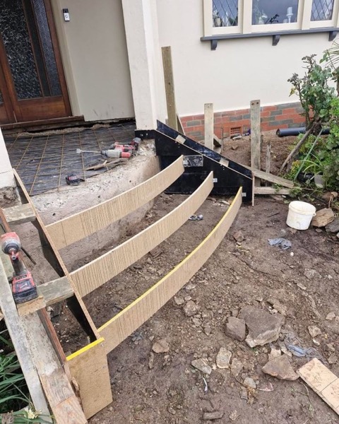 Curved timber formwork set up for a set of concrete steps